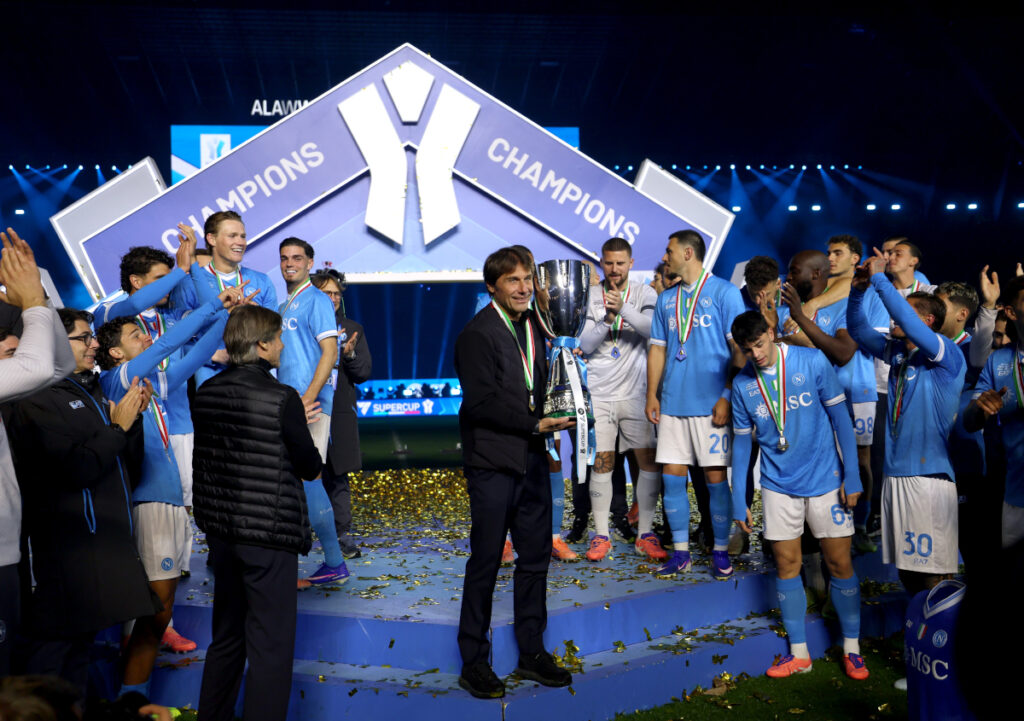 Antonio-Conte-Supercoppa-trophy-1024x721 Napoli defeat Bologna to claim Italian Super Cup as David Neres scores twice