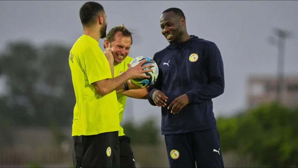 senegal-s-coach-pape-thiaw-shares-a-light-moment-with-coaching-staff-12-october-202516-1024x576 Thiaw claims Senegal merited more goals in Mali win
